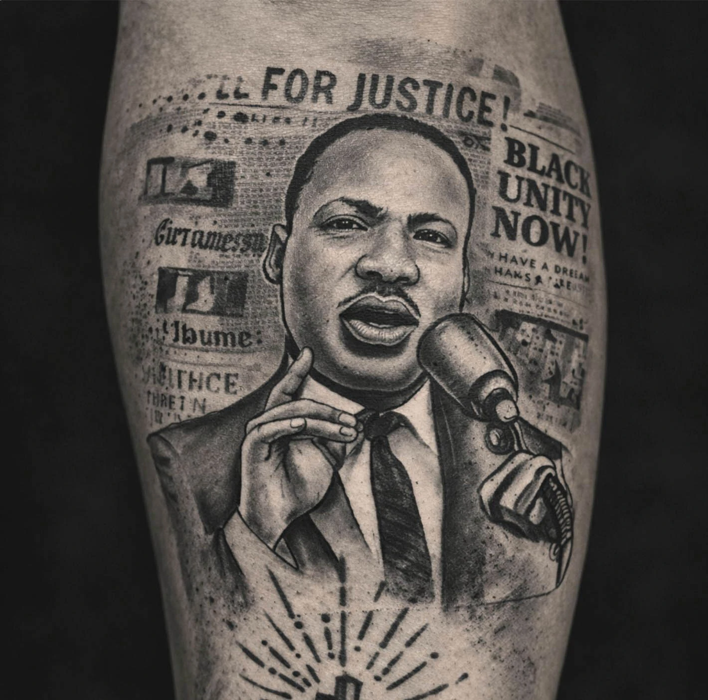 Black and grey realistic portrait tattoo with newspaper lettering background