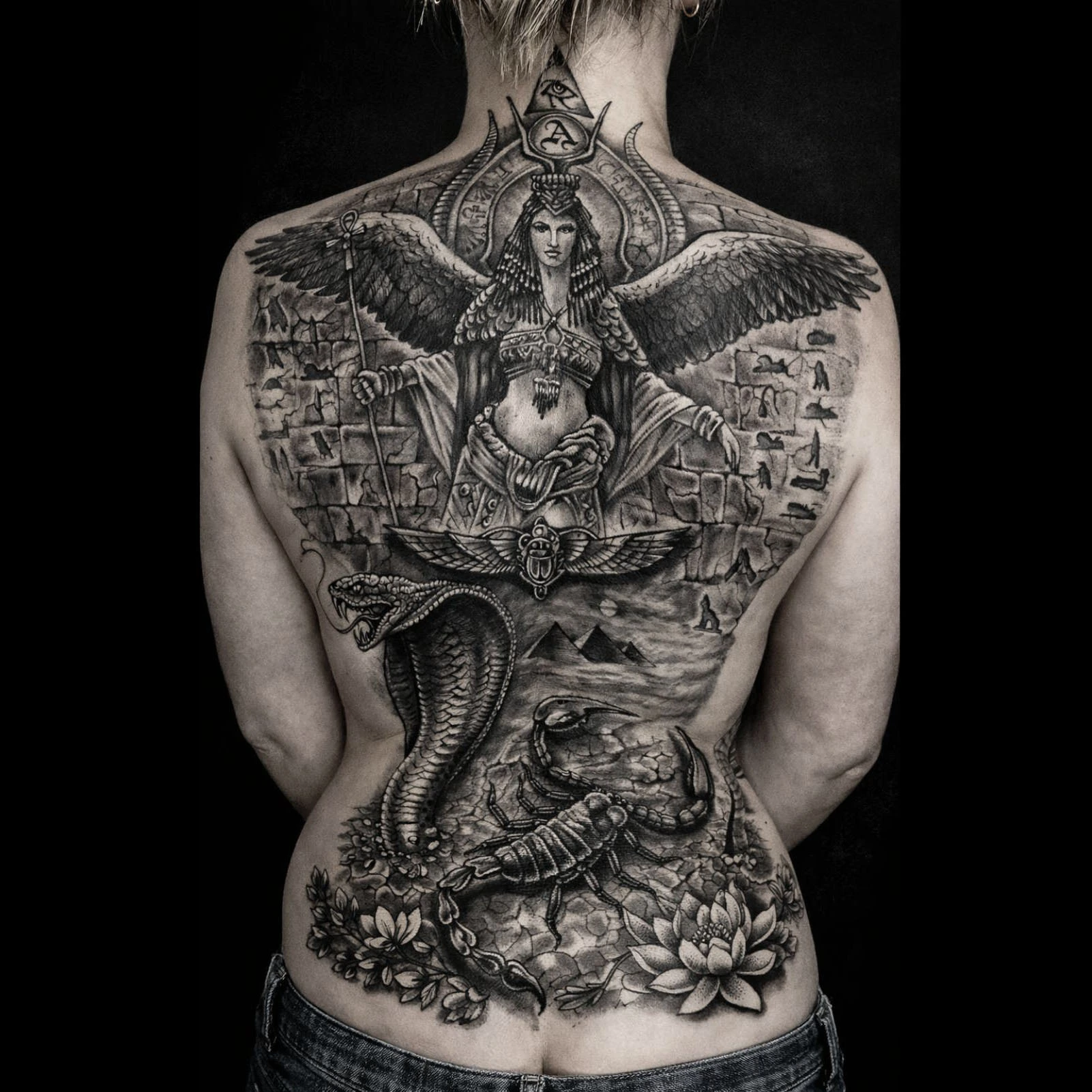 Large black and grey Egyptian goddess back piece tattoo