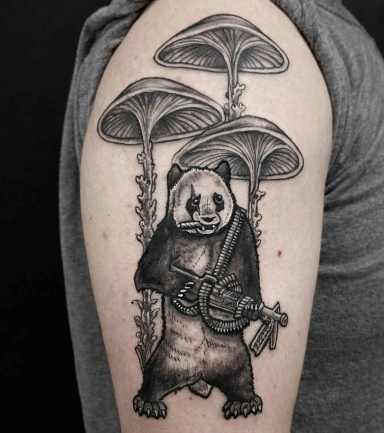Custom black and grey panda illustration tattoo